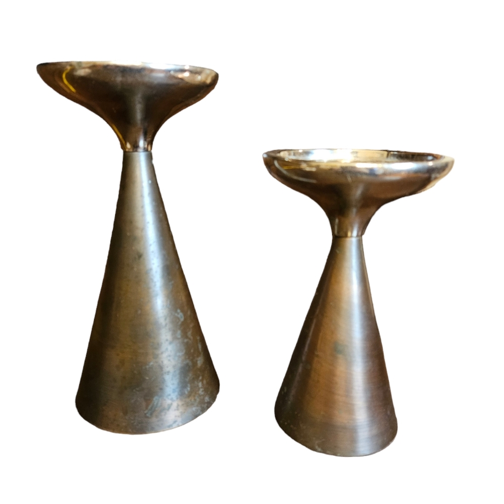 A pair of brass and chrome nesting candle holders. [copper - see description]